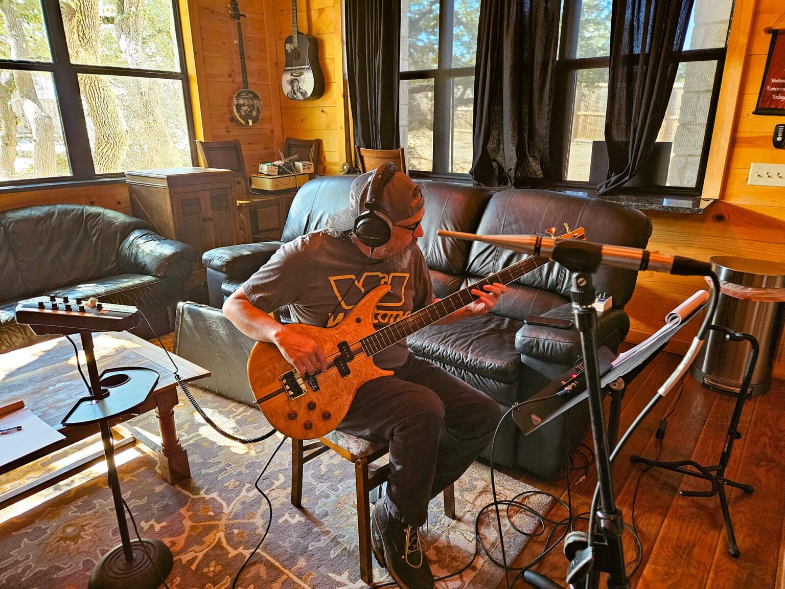 Daniel of Fascination 127 recording bass guitar during a late-night studio session at 4AM Radio in Austin, Texas